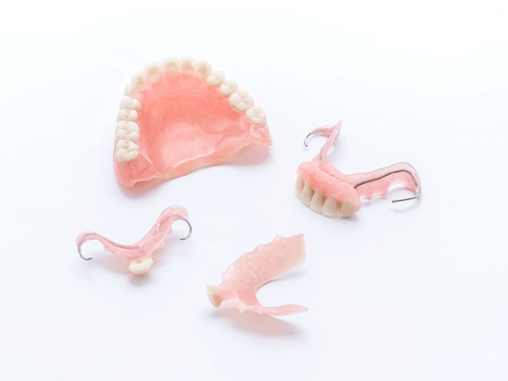 various types of dentures on a white background
